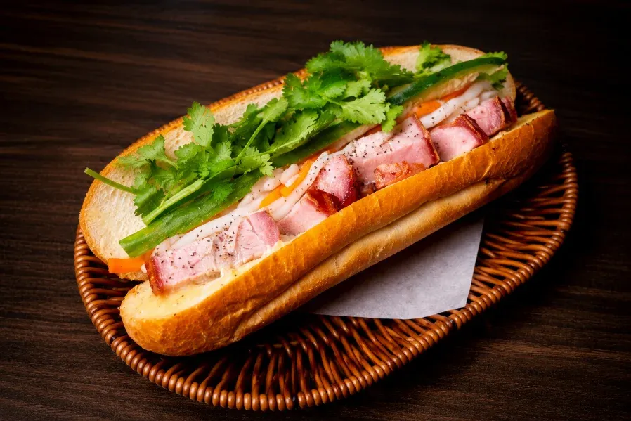Grilled pork banh mi on a crackly baguette